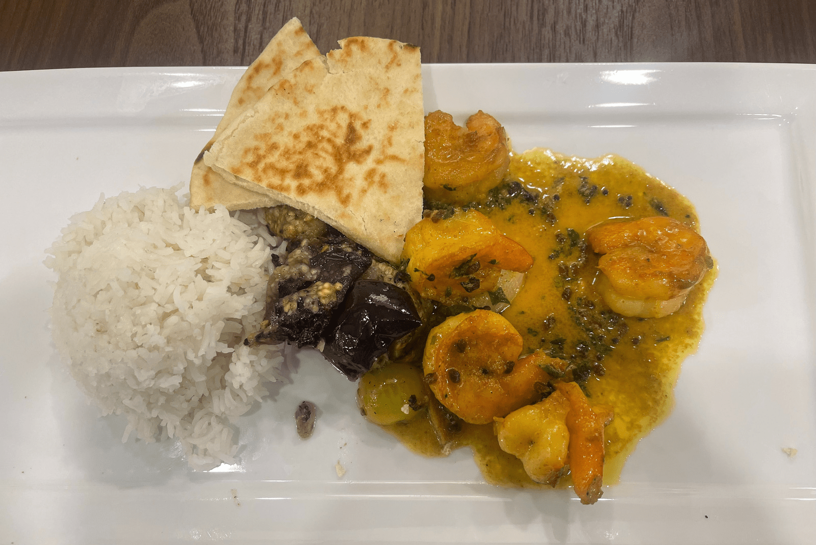 A plate of food with rice and shrimp.