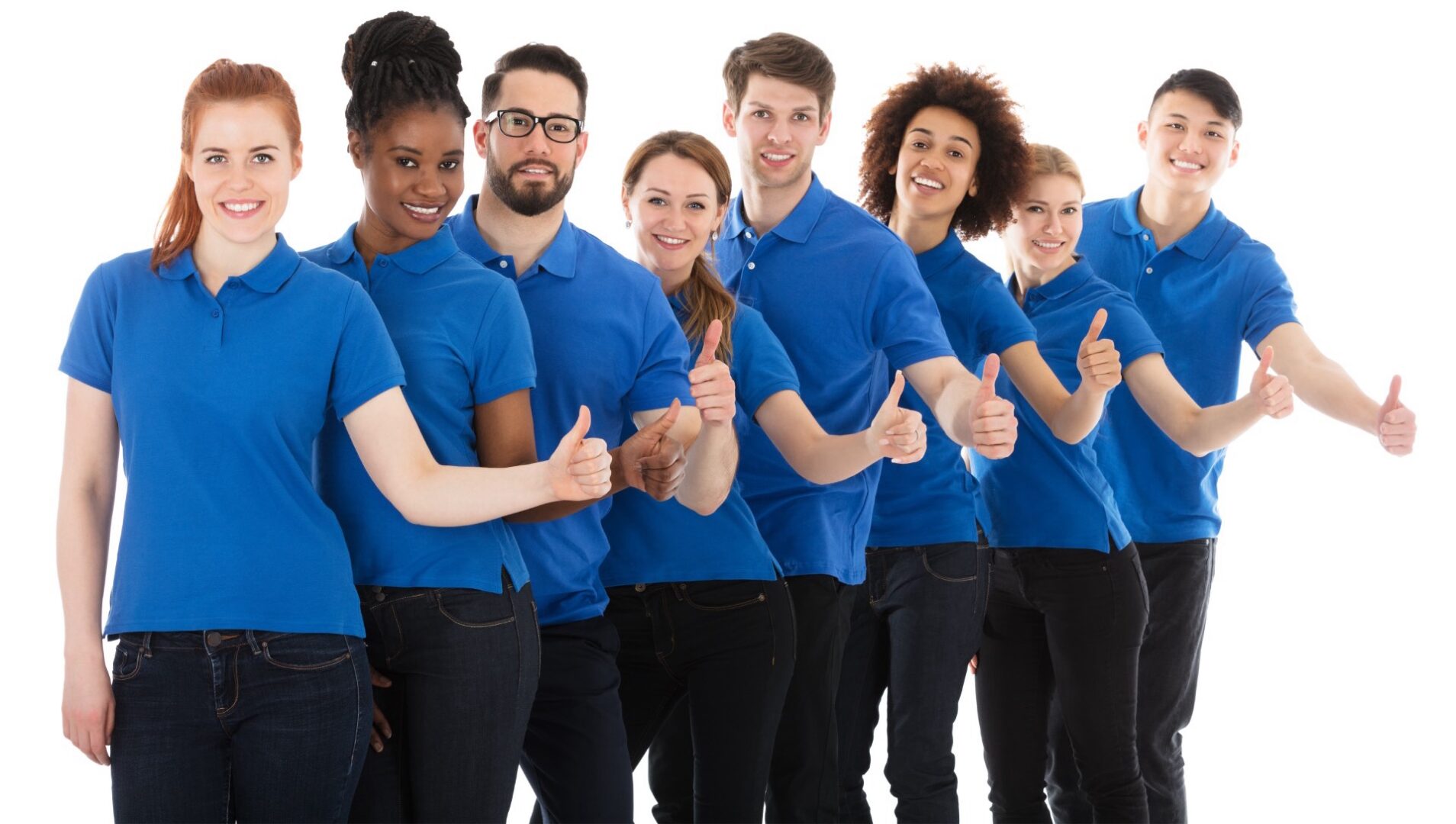A group of people in blue shirts giving thumbs up.