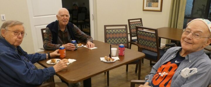 Three seniors socializing