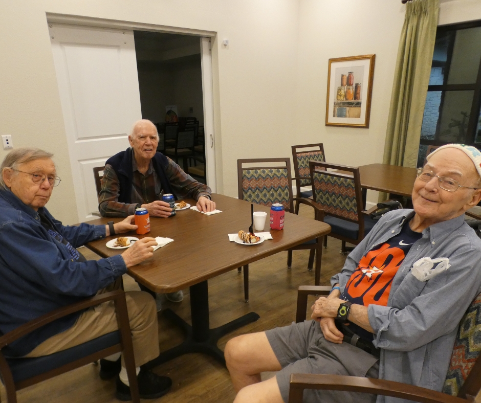 Three seniors socializing