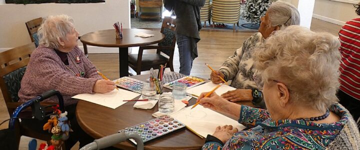 Assisted Living Residents having fun Following Along with Art Teacher