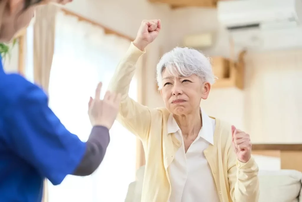 A caregiver fending off a loved one with dementia aggression.